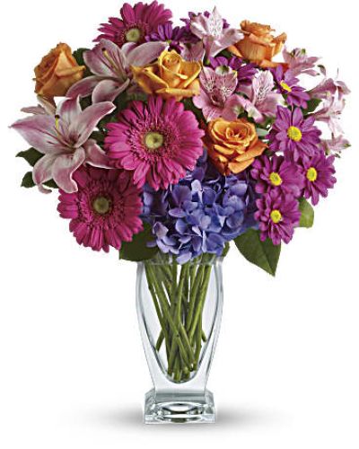 <p>Featuring a wide, wondrous assortment of blooms in one bouquet, this colorful arrangement is always a favorite! Hydrangea, roses, lilies, alstroemeria, gerberas, daisies - they're all here in stunning variety.<br />
This versatile mix includes blue hydrangea, orange roses, light pink asiatic lilies, pink alstroemeria, hot pink gerberas and purple daisies with a bit of rich green salal.</p>